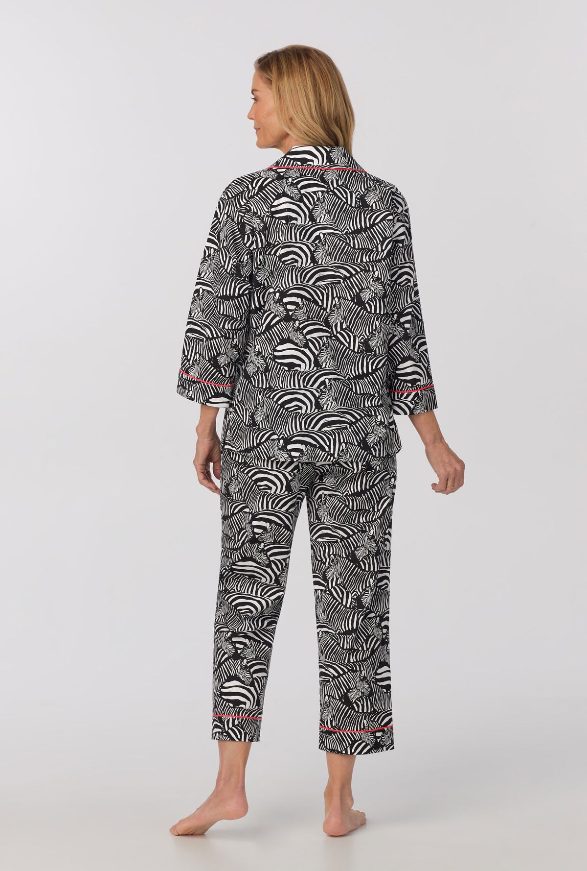 A lady wearing quarter Sleeve Classic Woven Cotton Cropped PJ Set with  Zebra Safari print