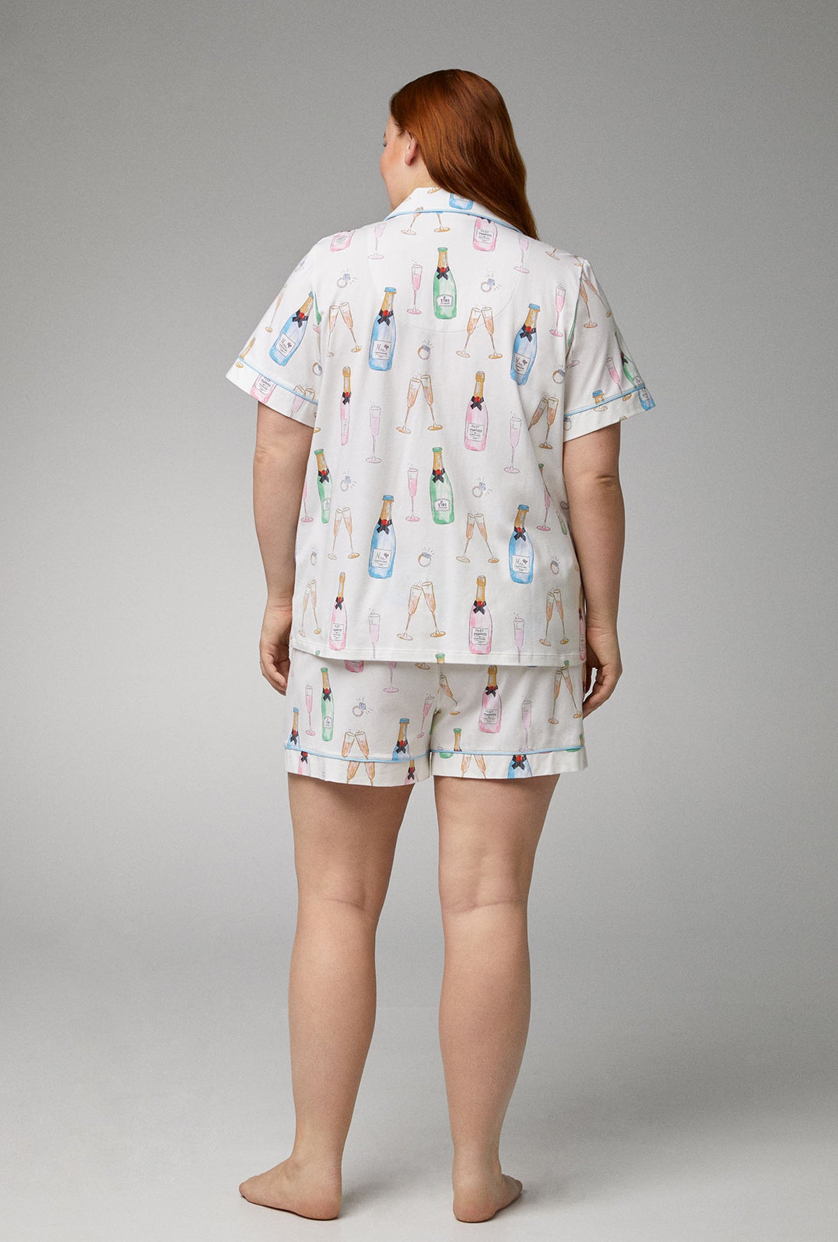A lady wearing Short Sleeve Classic Shorty Stretch Jersey plus size  PJ Set with Champagne Wedding print