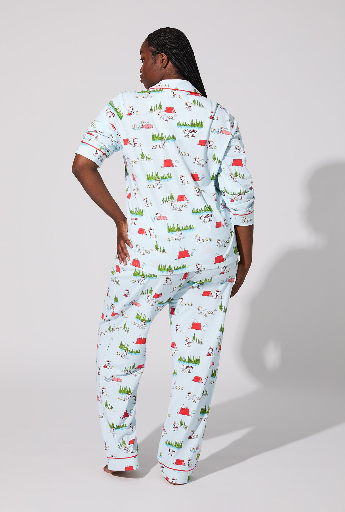 A lady wearing Peanuts® Camp Snoopy Long Sleeve Classic Stretch Jersey PJ Set