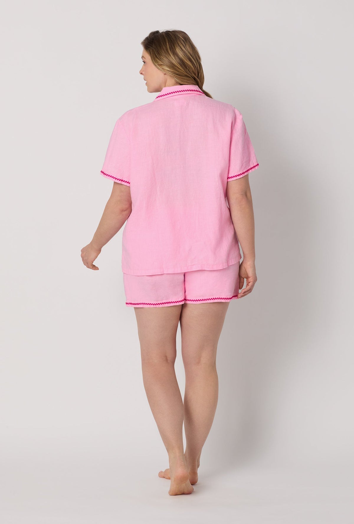 A lady wearing plus size Pink Short Sleeve Classic Shorty Woven Linen Pj Set back view