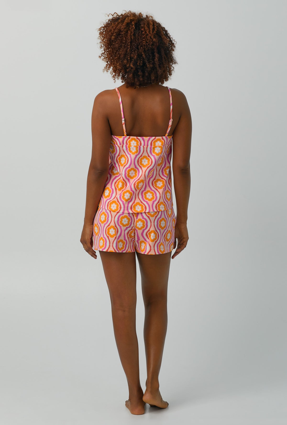A lady wearing Cami Stretch Jersey Shorty PJ Set with flower swirl print