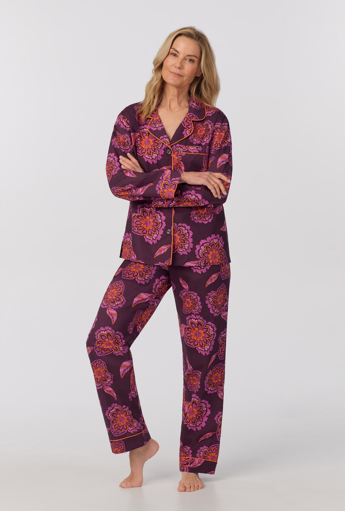 A lady wearing long Sleeve Classic Woven Cotton Poplin PJ Set with African Floral print