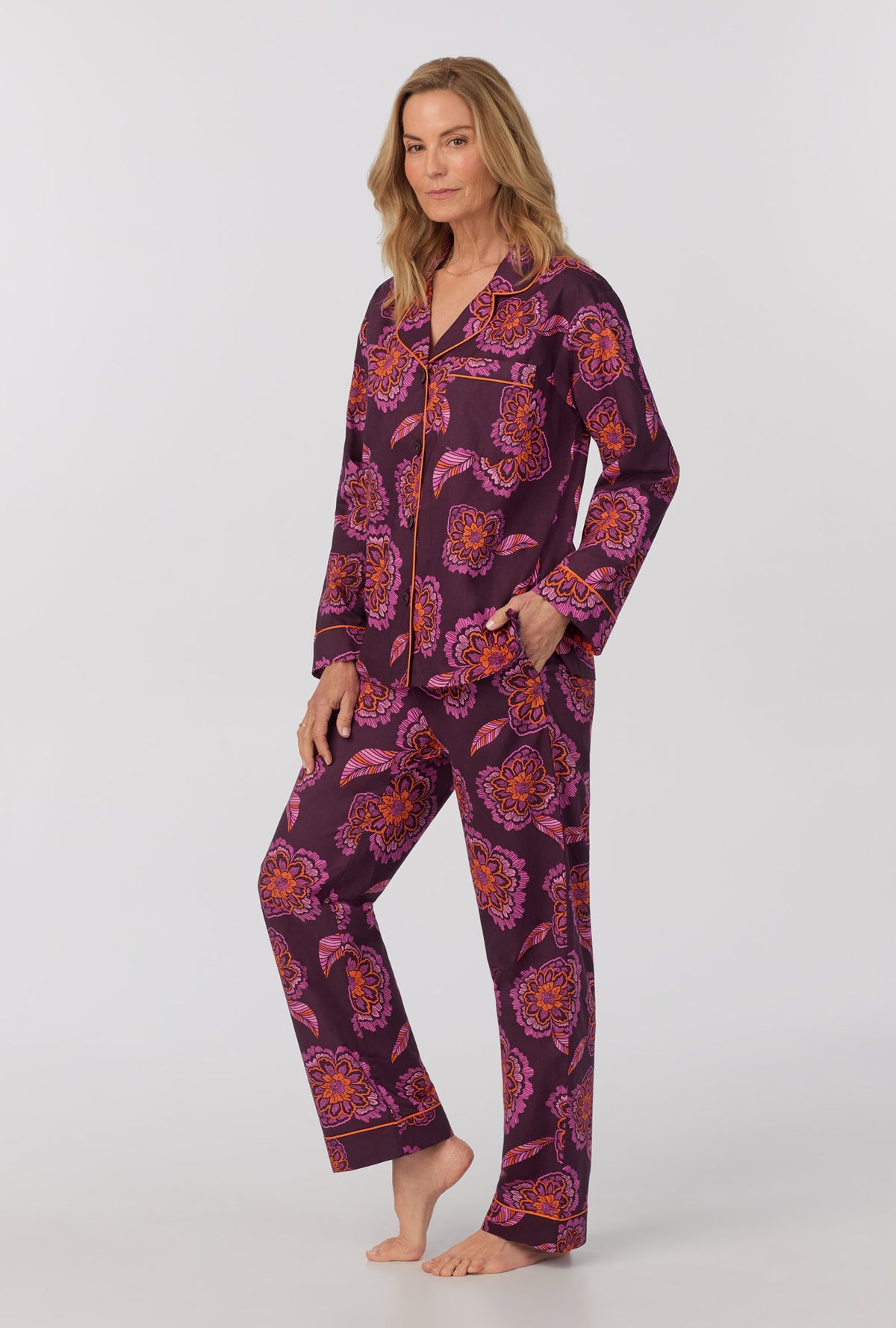 A lady wearing long Sleeve Classic Woven Cotton Poplin PJ Set with African Floral print