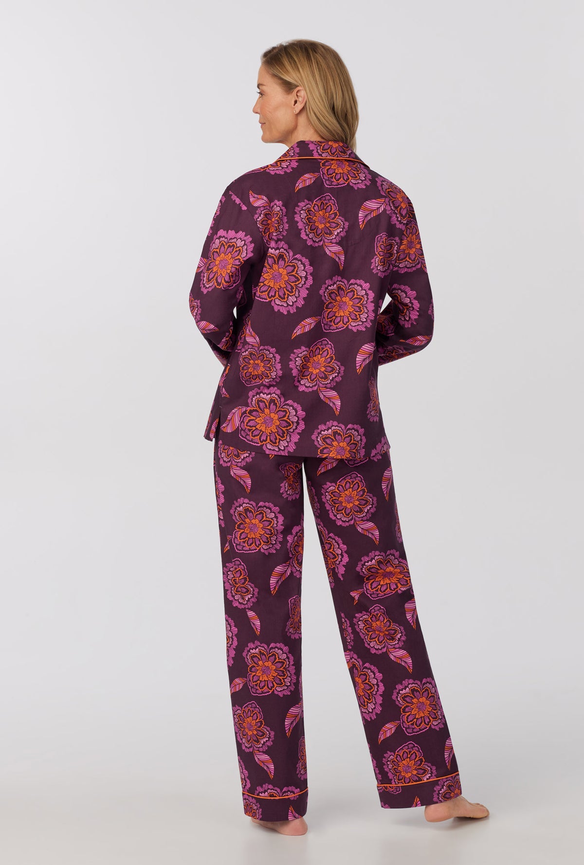 A lady wearing long Sleeve Classic Woven Cotton Poplin PJ Set with African Floral print