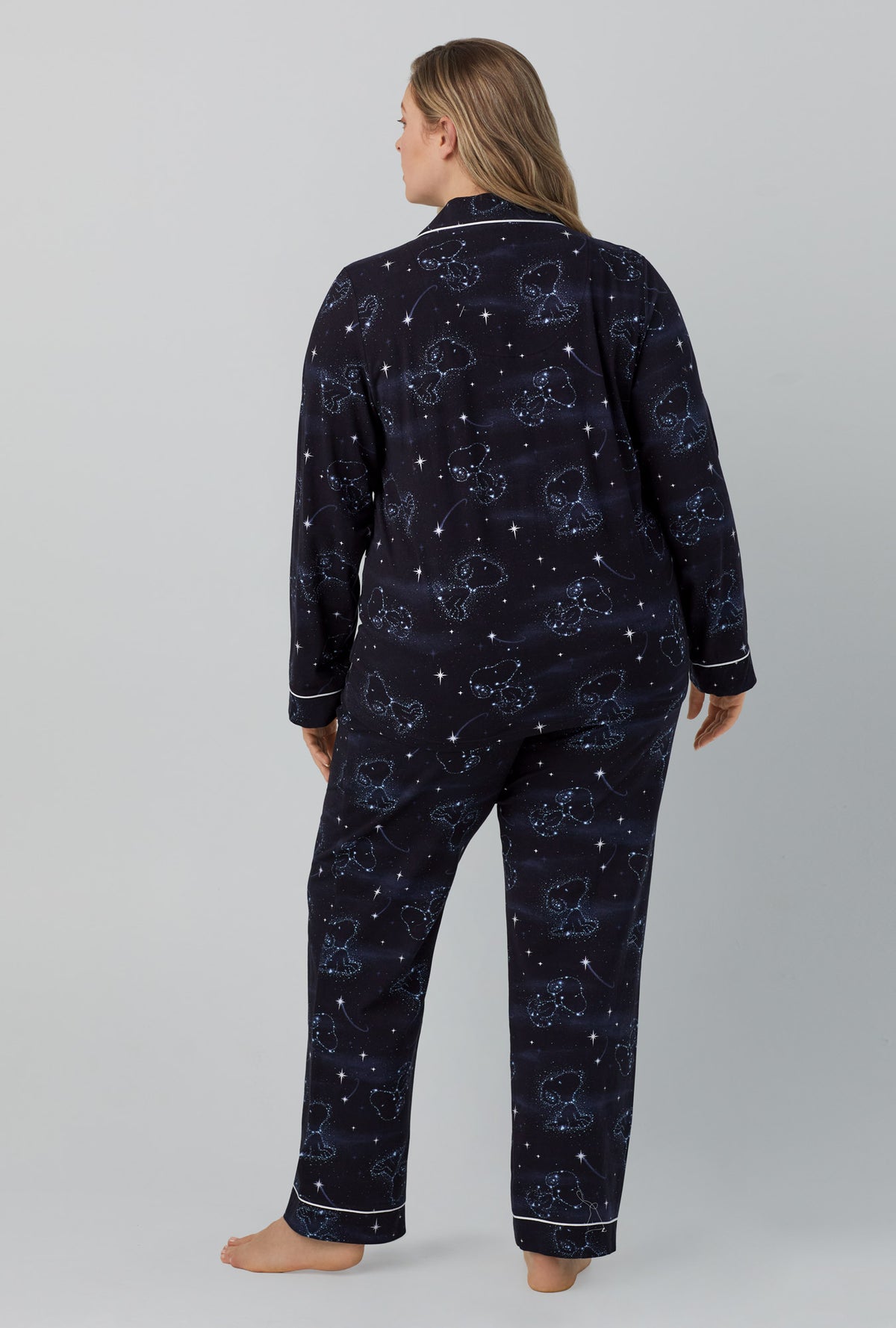 A lady wearing black  Long Sleeve Classic Stretch Jersey PJ Set with Celestial Snoopy  print