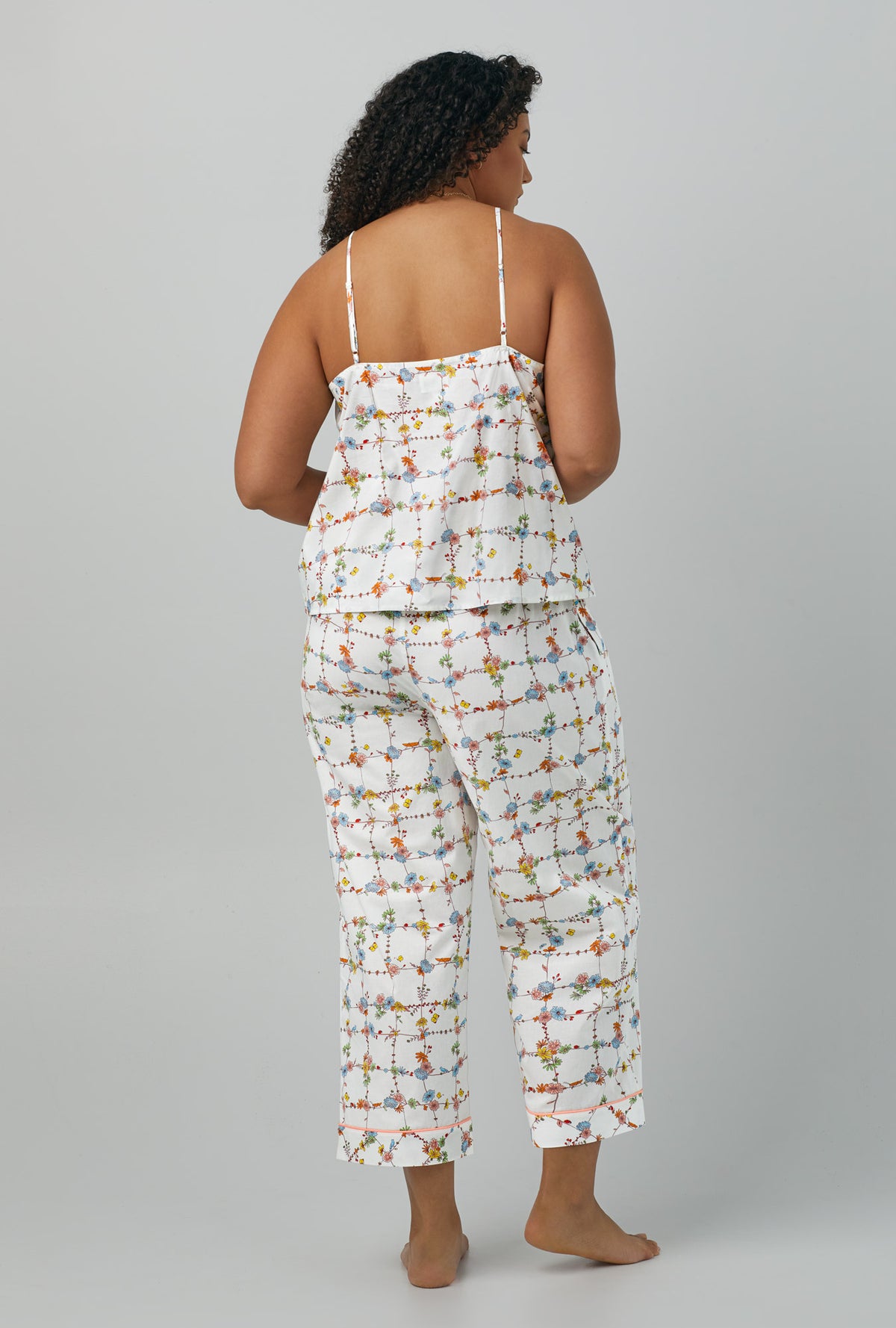 A lady wearing Tank Woven Cotton Poplin Cropped PJ Set with spring vines print