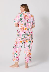 A Lady Wearing Plus Size Tropical Daydream Short Sleeve Classic Stretch Jersey Cropped Pj Set posing with a back view look