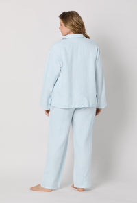 A lady wearing plus size Baby's Breath Blue Long Sleeve Classic Woven Linen Pj Set back view