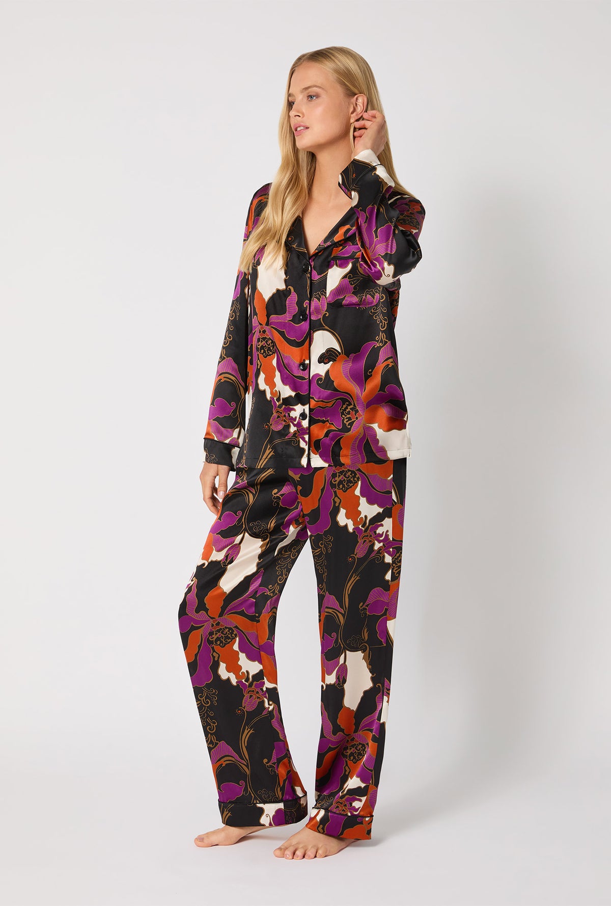 A lady wearing BedHead X Trina Turk Fall Floral Long Sleeve Classic Washable Silk PJ Set