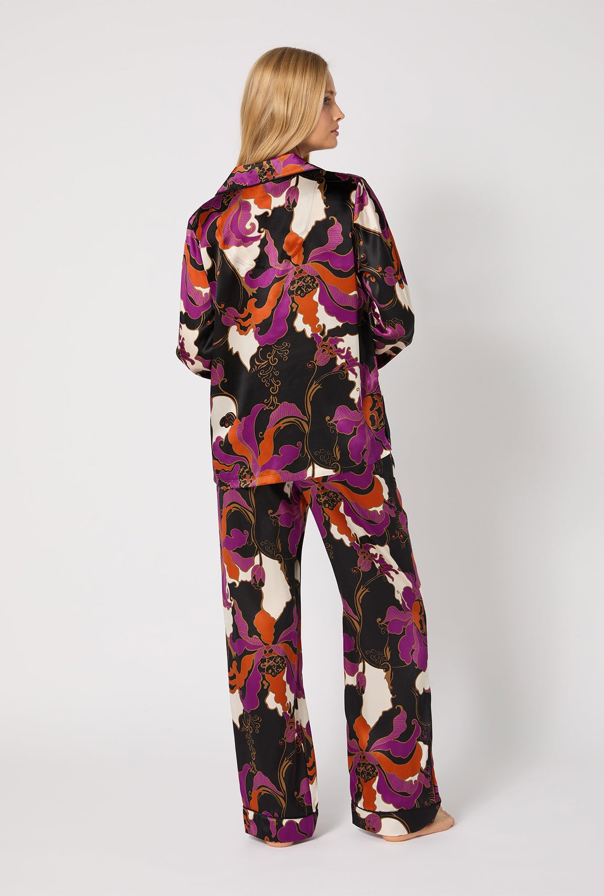 A lady wearing BedHead X Trina Turk Fall Floral Long Sleeve Classic Washable Silk PJ Set