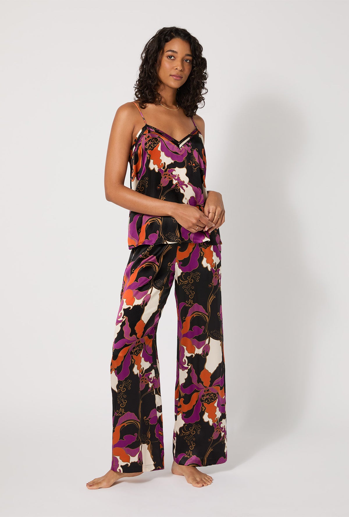 A lady wearing BedHead X Trina Turk Fall Floral Cami Tank Woven Washable Silk Long PJ Set