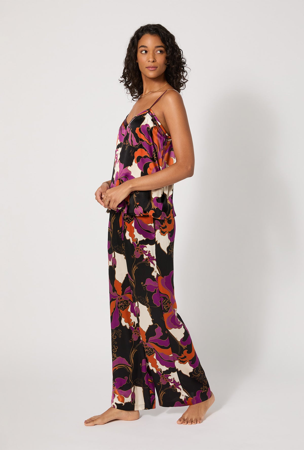 A lady wearing BedHead X Trina Turk Fall Floral Cami Tank Woven Washable Silk Long PJ Set