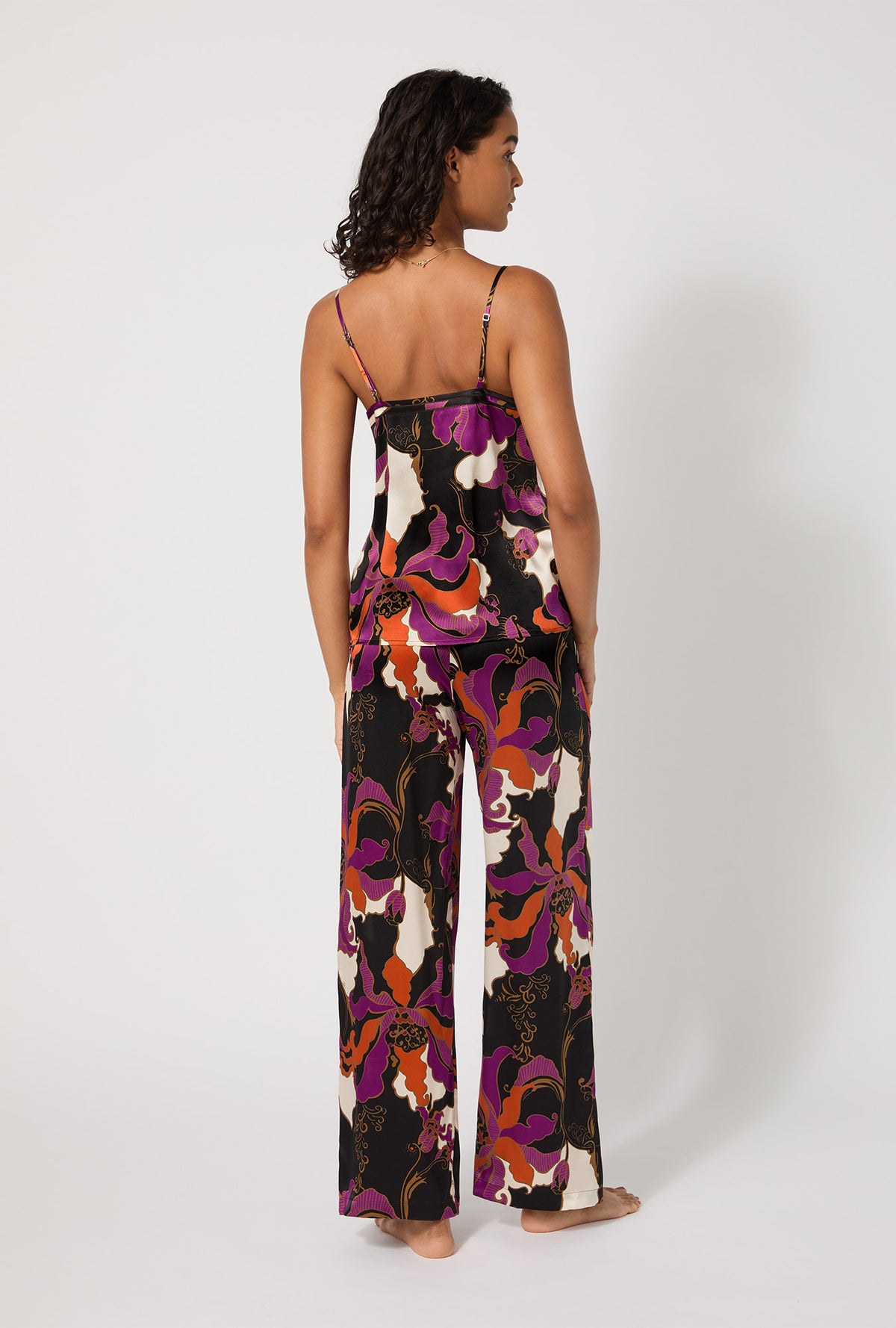 A lady wearing BedHead X Trina Turk Fall Floral Cami Tank Woven Washable Silk Long PJ Set