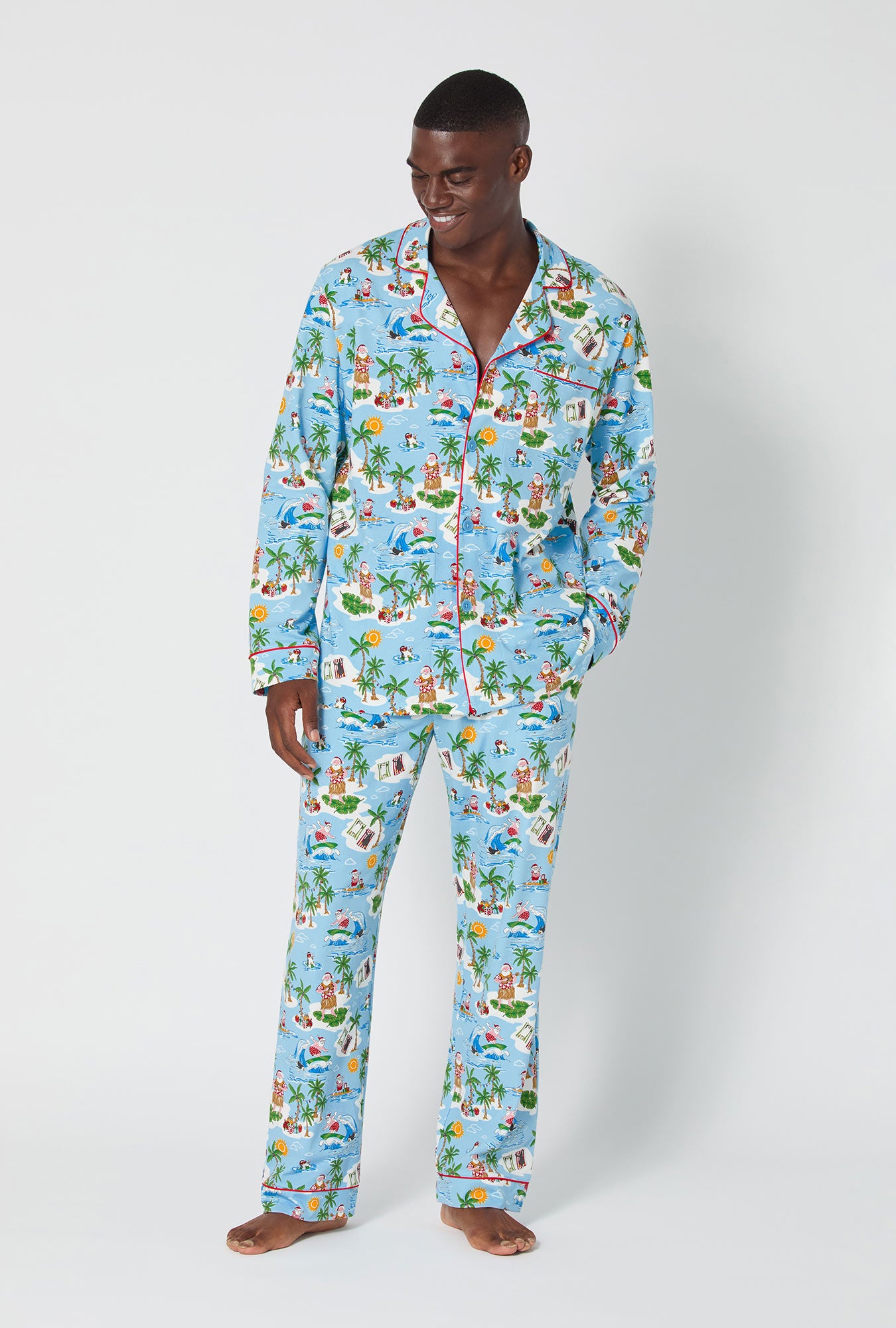 A man wearing Surfin' Santa Men's Long Sleeve Classic Stretch Jersey Pj Set