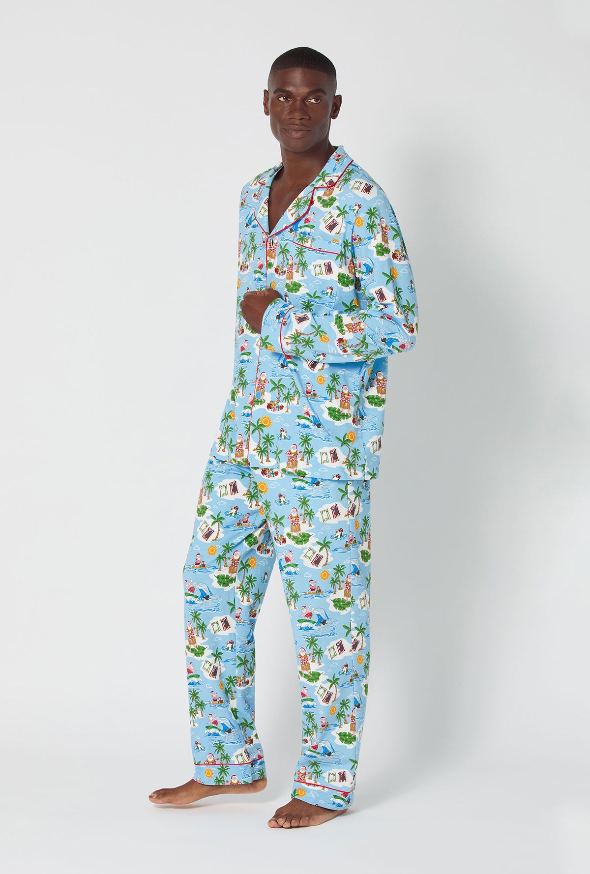 A man wearing Surfin&#39; Santa Men&#39;s Long Sleeve Classic Stretch Jersey Pj Set