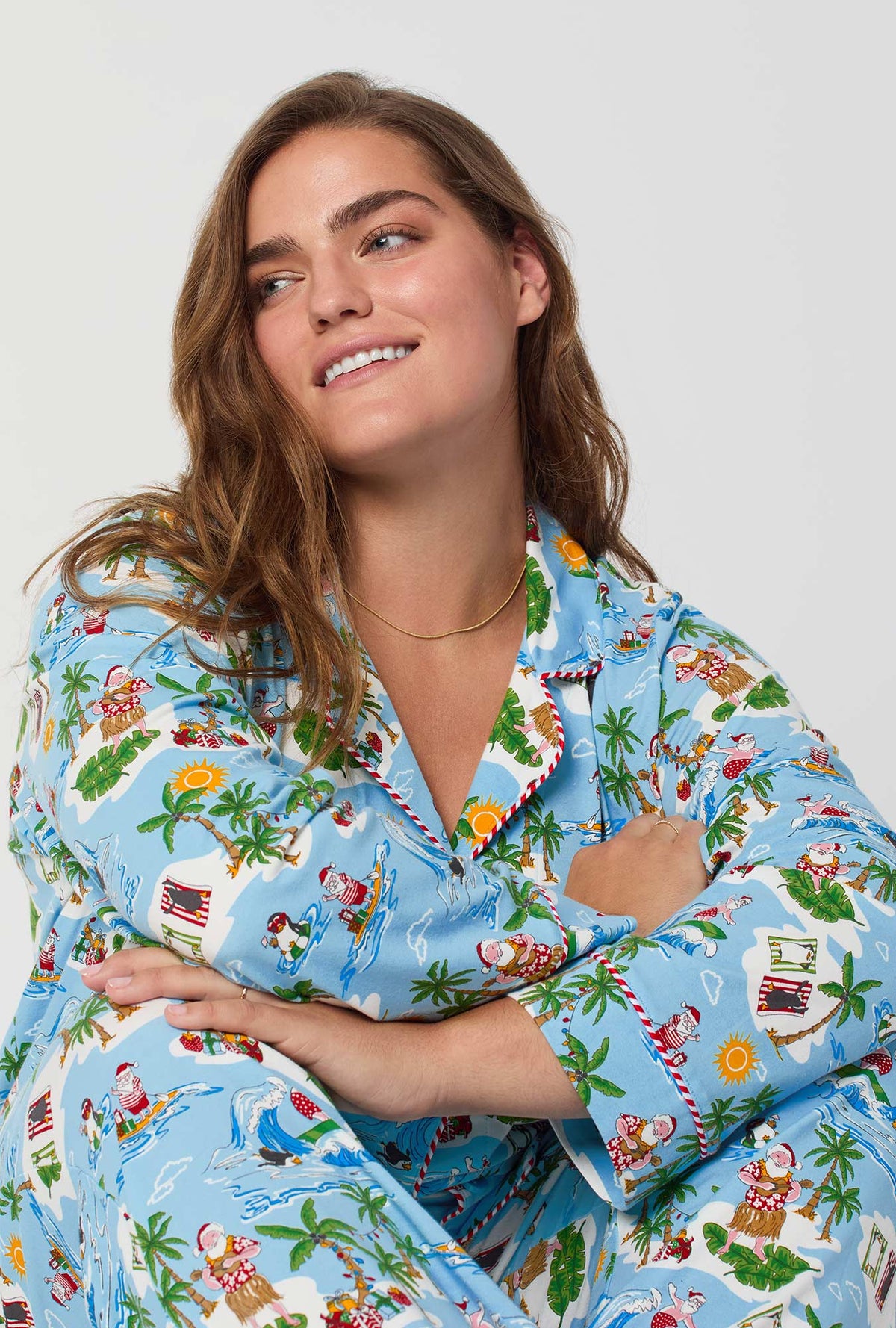 A lady wearing Surfin&#39; Santa Long Sleeve Classic Stretch Jersey Pj Set