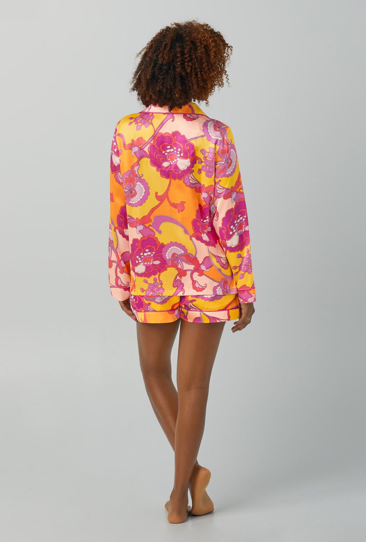 A lady wearing Long Sleeve Classic Washable Silk Satin Short PJ Set with apache bloom print