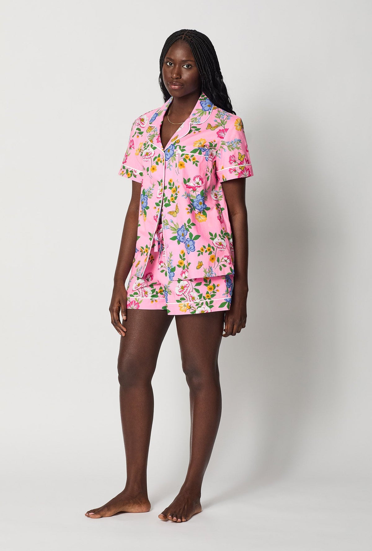 A lady wearing Pink Short Sleeve Classic Woven Cotton Poplin Shorty Pj Set side view