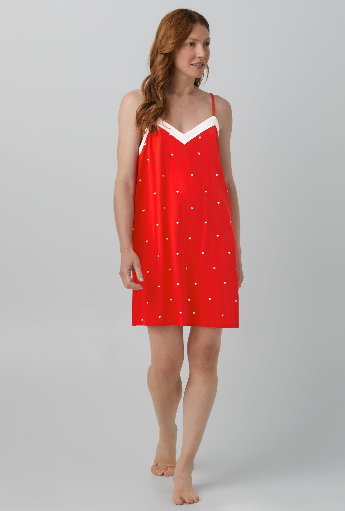 A lady wearing red chemise with tiny hearts print