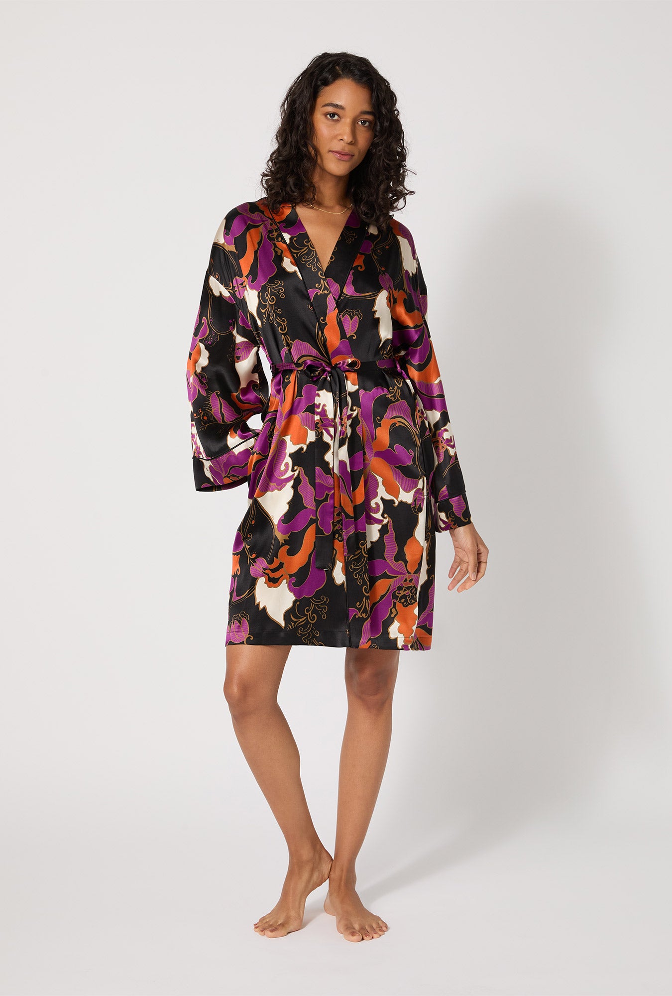 A lady wearing BedHead X Trina Turk Fall Floral Banded Collar Washable Silk Robe