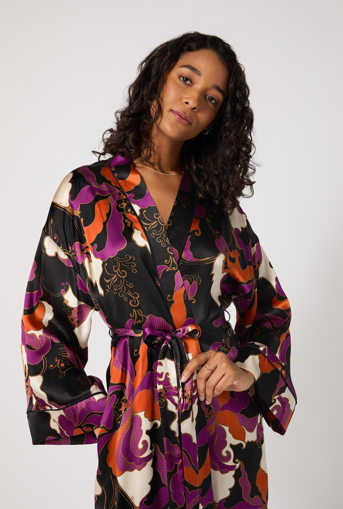 A lady wearing BedHead X Trina Turk Fall Floral Banded Collar Washable Silk Robe