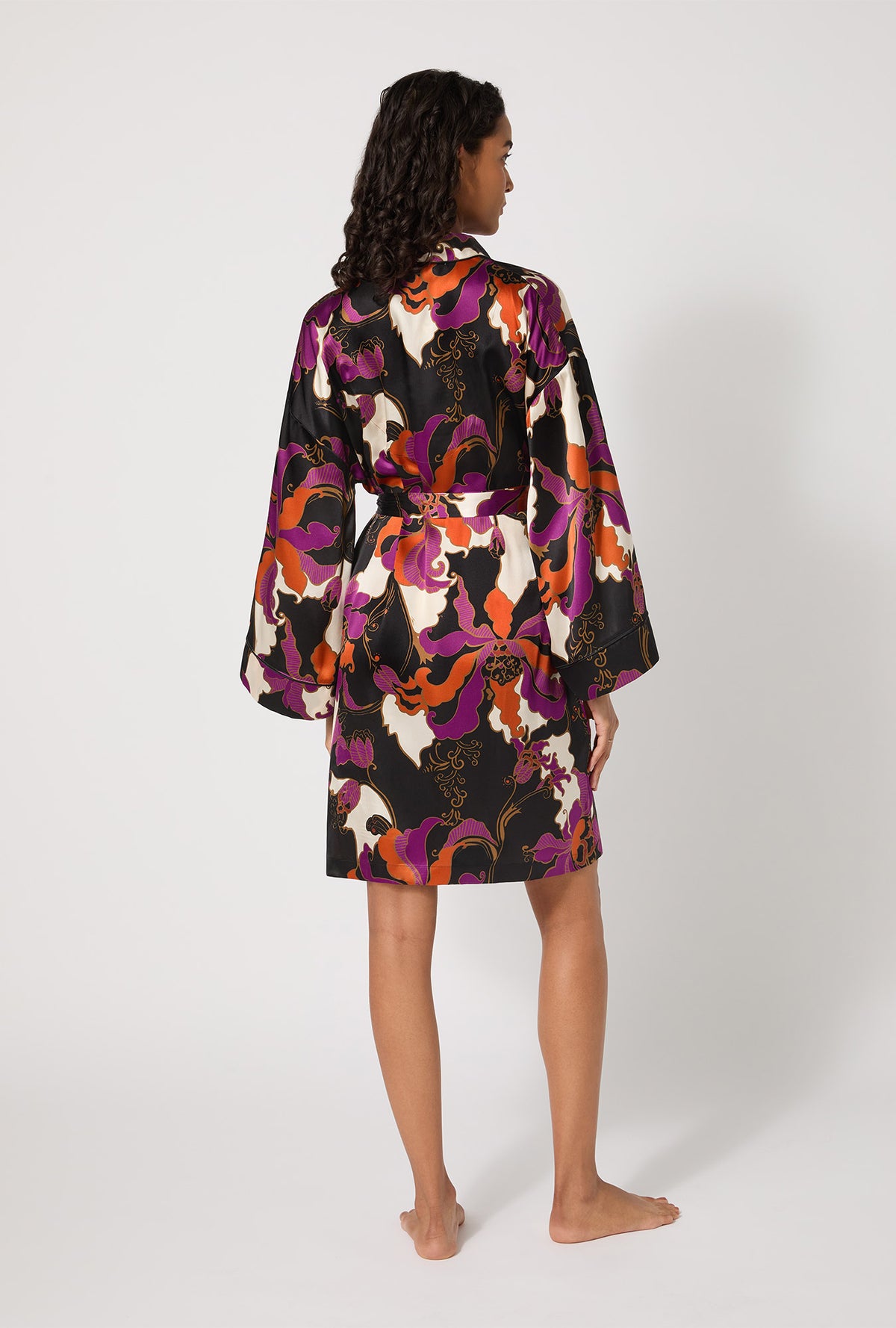 A lady wearing BedHead X Trina Turk Fall Floral Banded Collar Washable Silk Robe