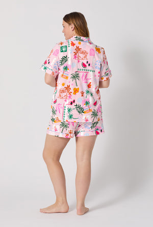 A Lady Wearing Plus Size Tropical Daydream Short Sleeve Classic Shorty Stretch Jersey Pj Set posing with a back view look