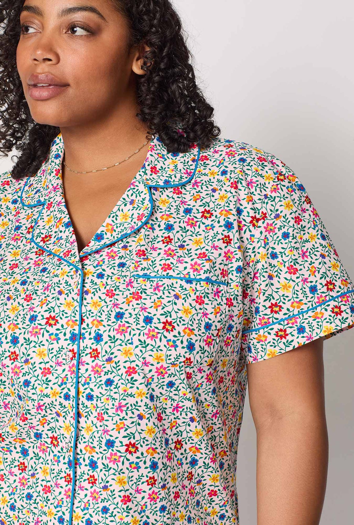 A closeup of A lady wearing plus size Multi-Color and  Pink Short Sleeve Classic Woven Cotton Poplin Cropped Pj Set