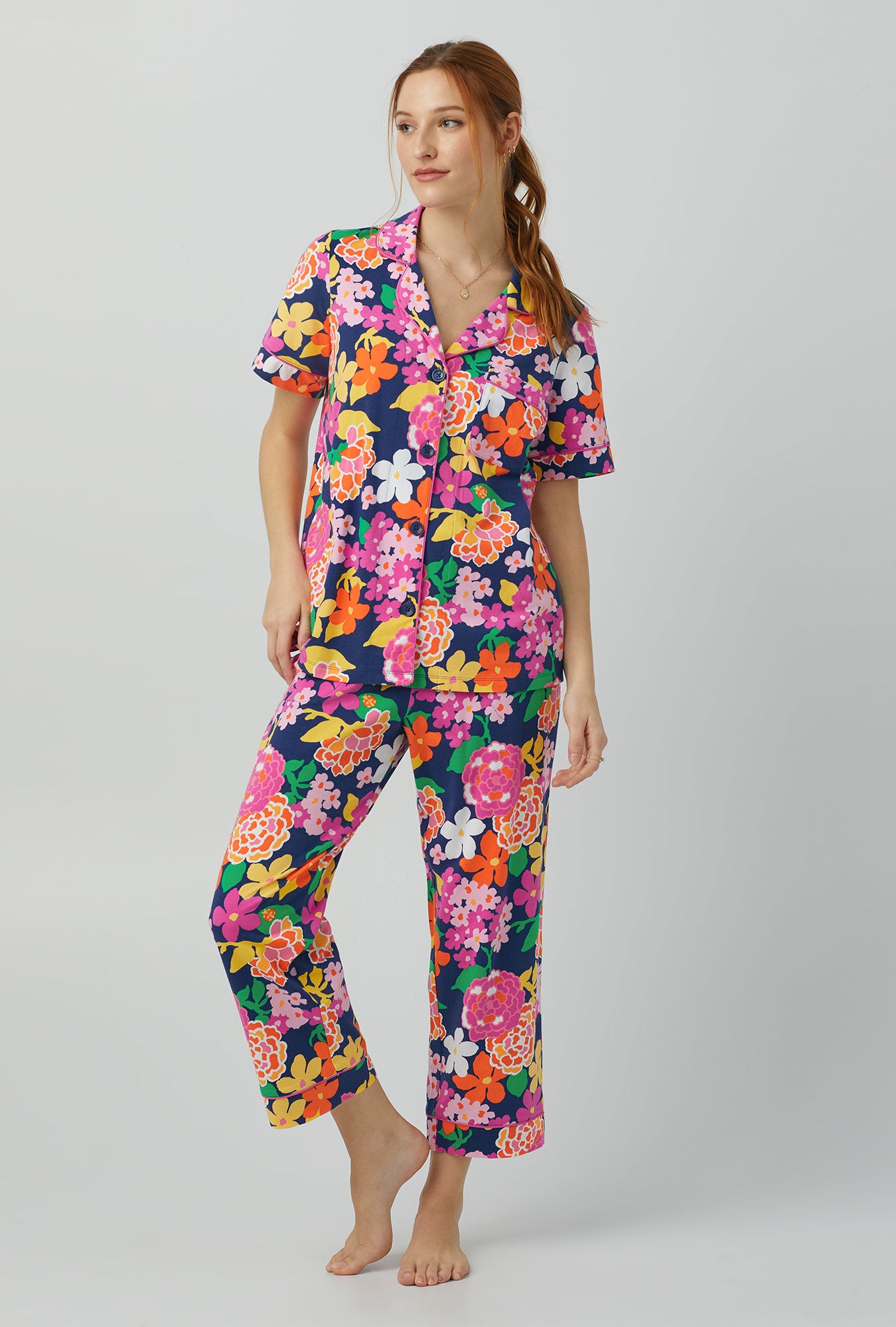 A lady wearing Short Sleeve Classic Stretch Jersey Cropped PJ Set with greenhouse floral print