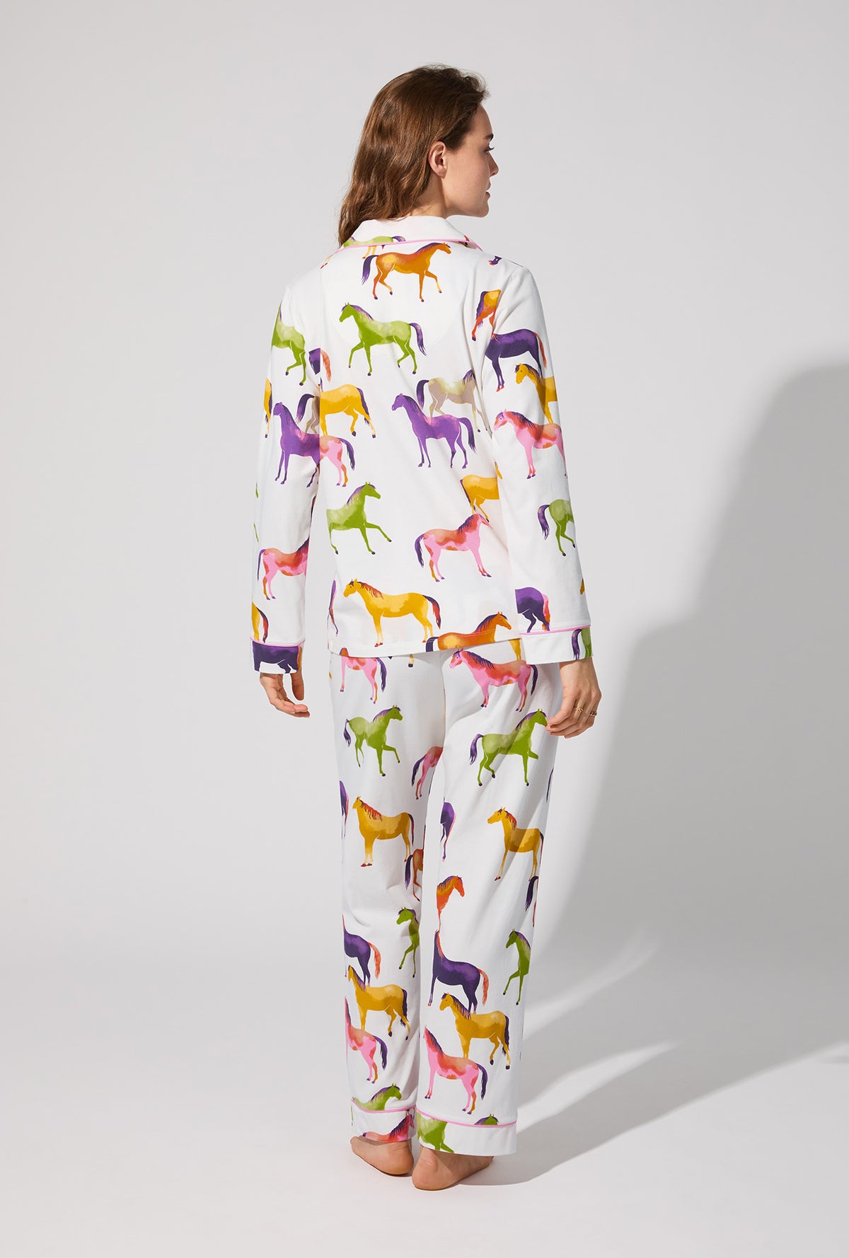 A lady wearing Equestrian Parade Long Sleeve Classic Stretch Jersey PJ Set