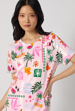 A Lady Wearing Tropical Daydream Stretch Jersey T-shirt Sleep Dress posing in a close up view look