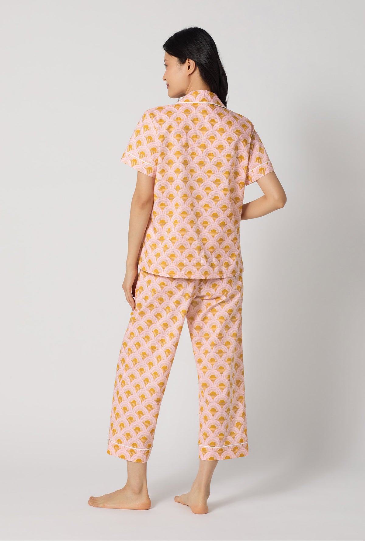 A Lady Wearing Deco Sunset Short Sleeve Classic Woven Cotton Poplin Cropped Pj Set showing the back view