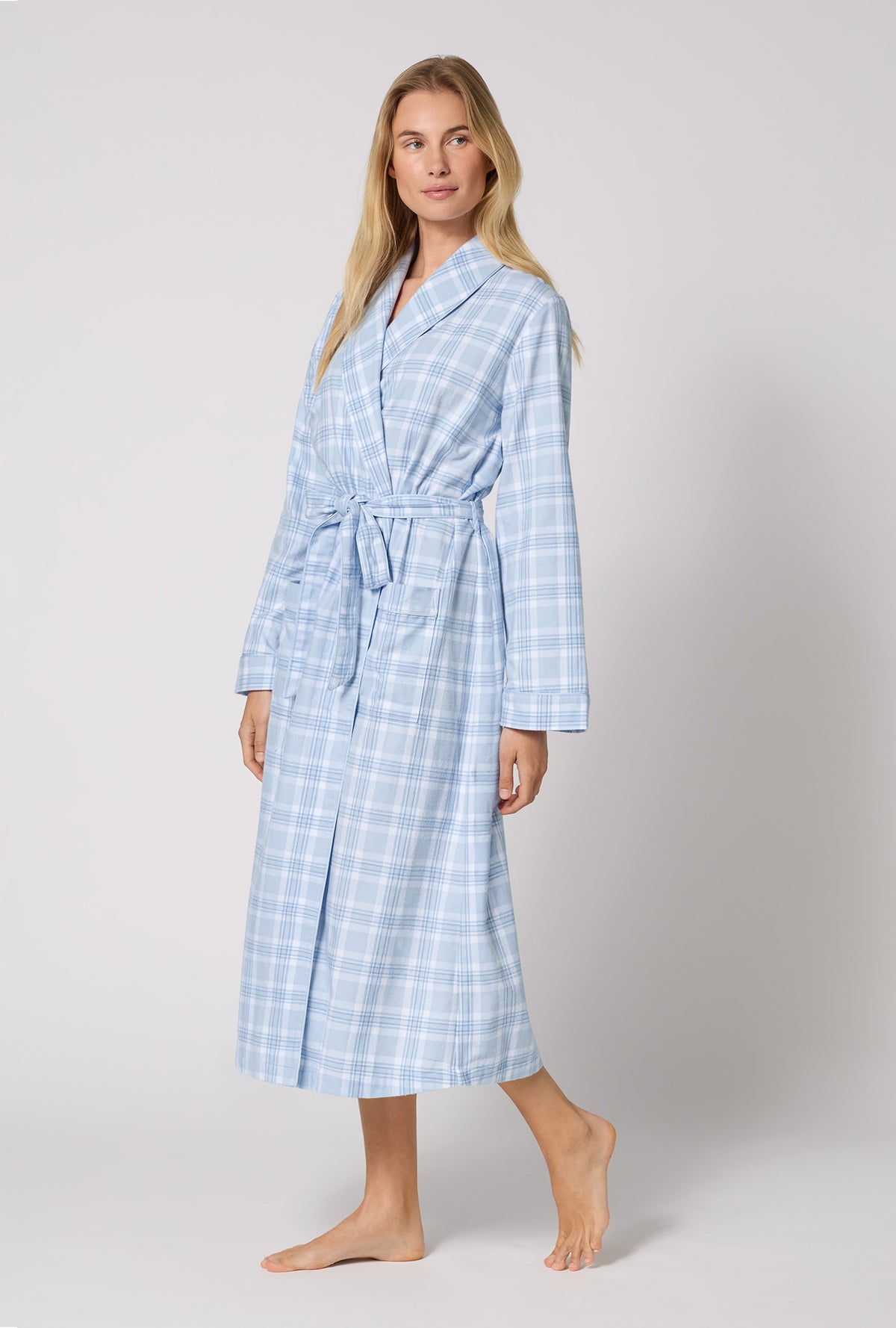 A lady wearing Meadow Haze Plaid Unisex Classic Woven Portuguese Flannel Robe De Chambre looking side