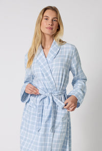 A lady wearing Meadow Haze Plaid Unisex Classic Woven Portuguese Flannel Robe De Chambre closer look