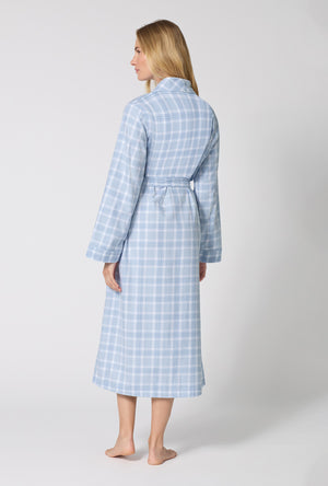 A lady wearing Meadow Haze Plaid Unisex Classic Woven Portuguese Flannel Robe De Chambre back view
