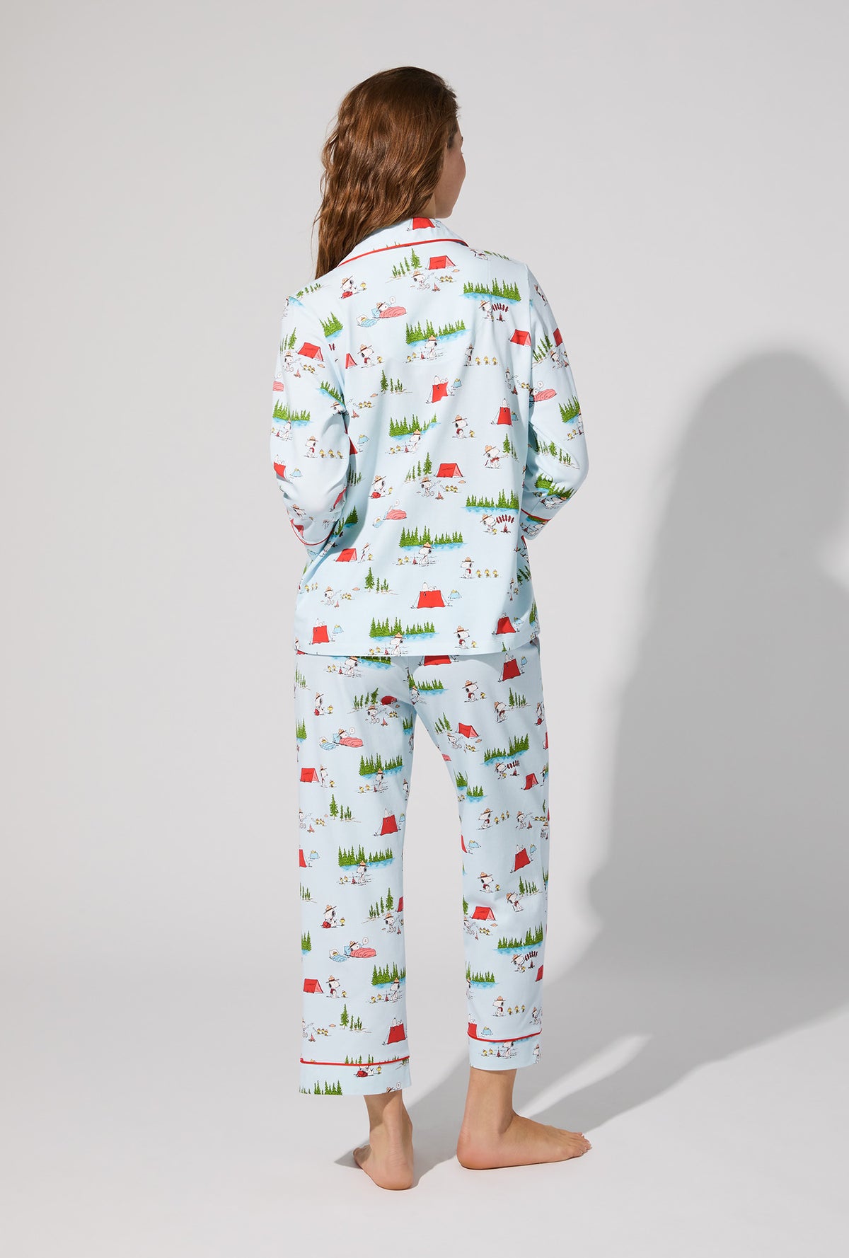 A lady wearing Peanuts® Camp Snoopy  3/4 Sleeve Classic Stretch Jersey Cropped PJ Set