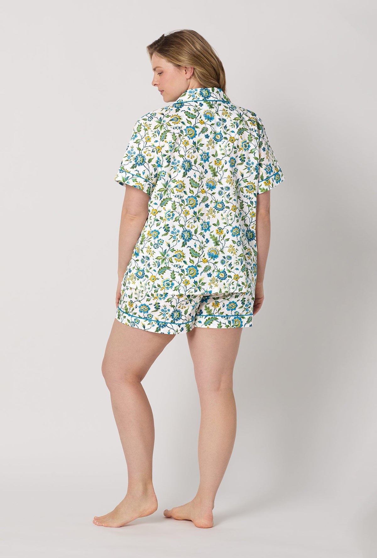 A lady wearing plus size White Short Sleeve Classic Shorty Woven Tana Lawn® PJ Set Made with Liberty Fabric back view