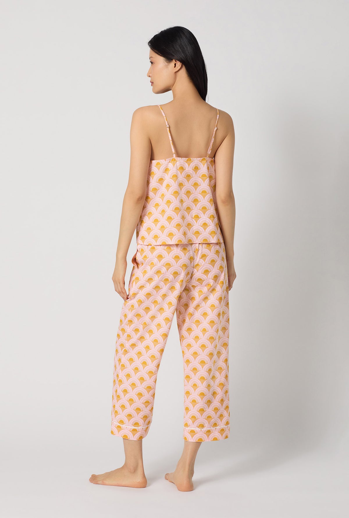 A Lady Wearing Deco Sunset Cami Woven Cotton Poplin Cropped Pj Set posing in a back view look