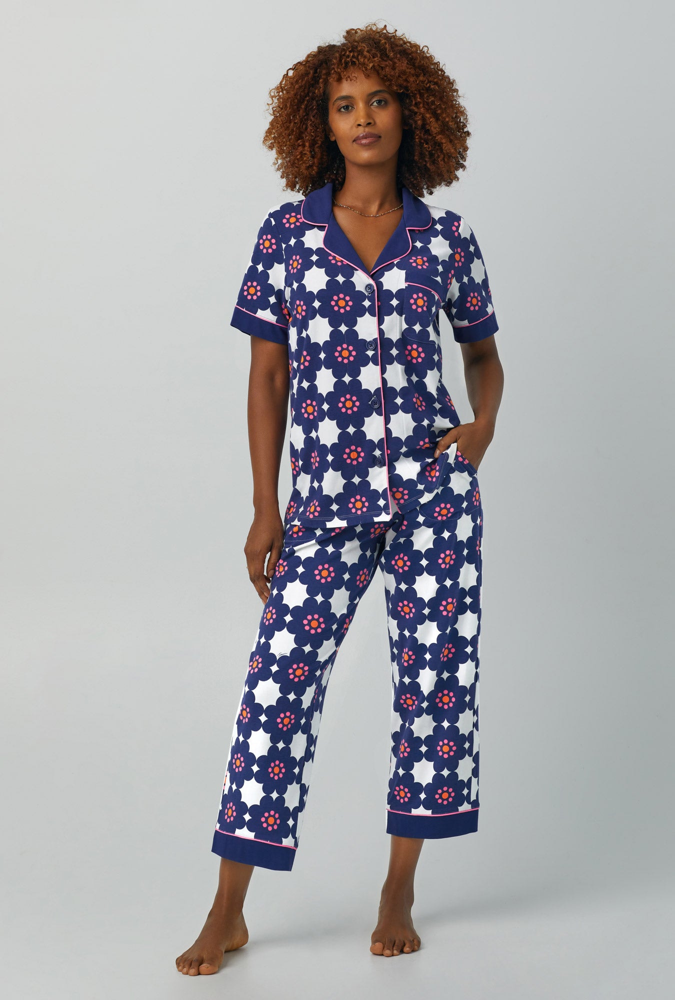 A lady wearing Short Sleeve Classic Stretch Jersey Cropped PJ Set with floral tile print