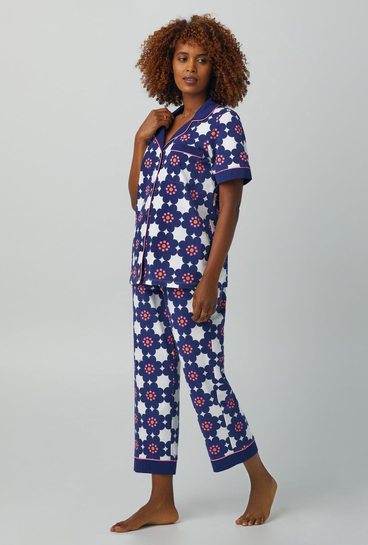 A lady wearing Short Sleeve Classic Stretch Jersey Cropped PJ Set with floral tile print
