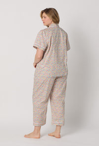 A lady wearing plus size Emma & Georgina Short Sleeve Classic Woven Tana Lawn® Cropped Pj Set Made With Liberty Fabric back view
