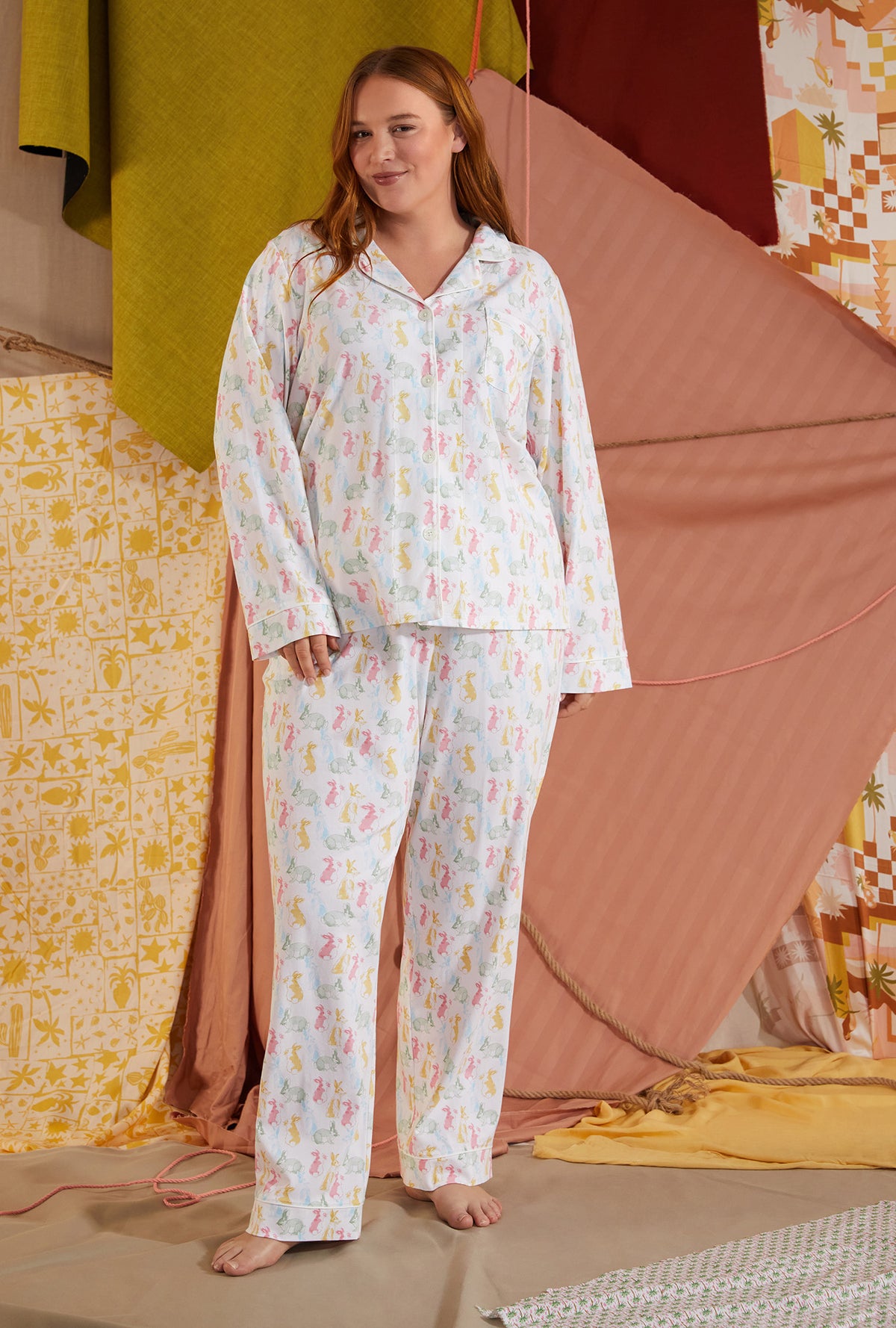 A lady wearing white long sleeve classic plus size pj set with cottontail print