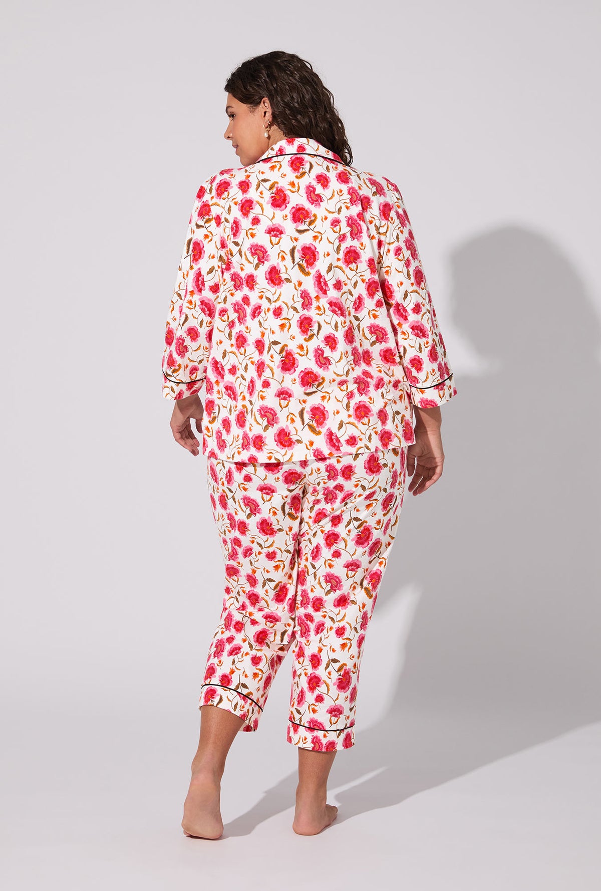 A lady wearing Fantasia Floral 3/4 Sleeve Classic Stretch Jersey Cropped PJ Set