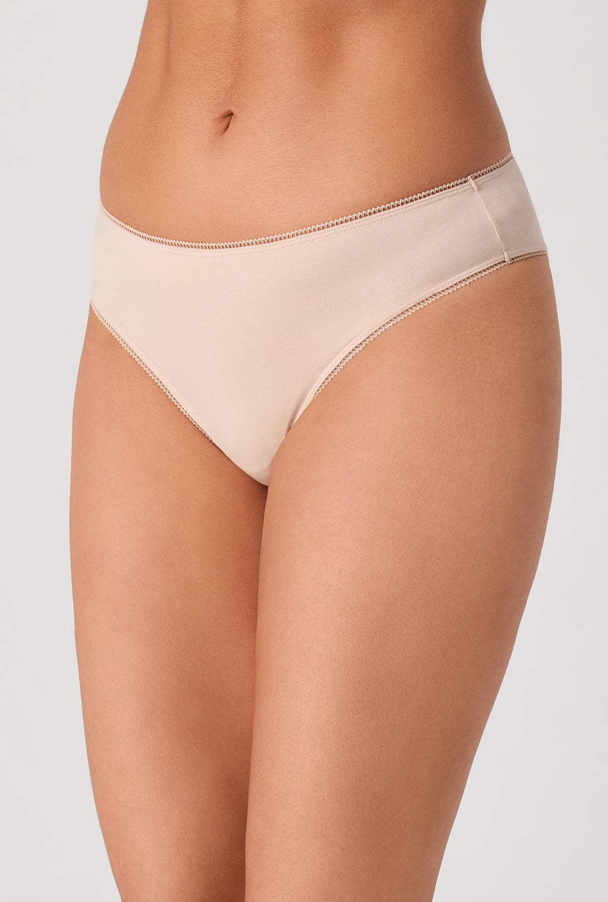 A lady wearing Nude Stretch Jersey Thong Underwear