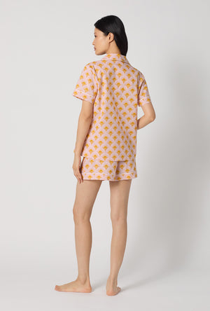 A Lady Wearing Deco Sunset Short Sleeve Classic Woven Cotton Poplin Shorty Pj Set showing back view