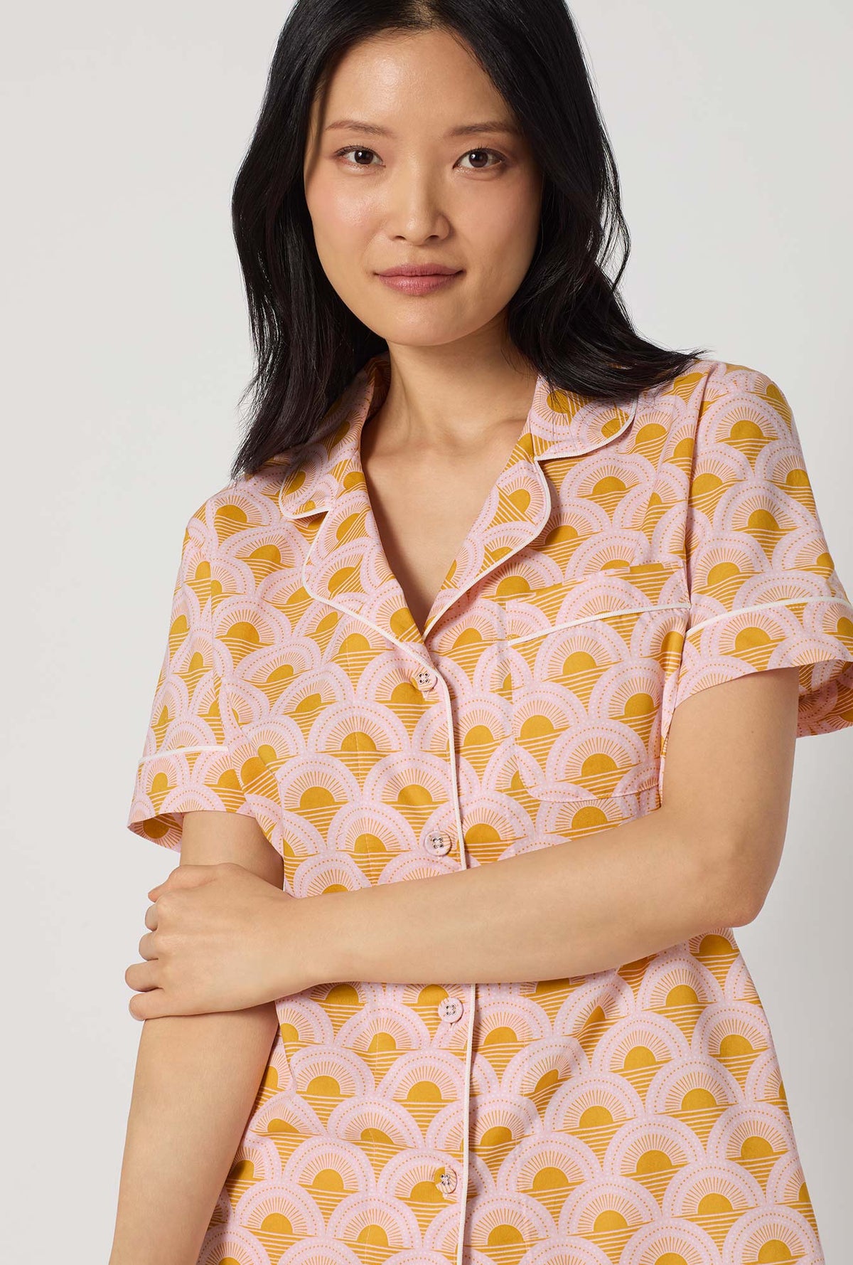 A Lady Wearing Deco Sunset Short Sleeve Classic Woven Cotton Poplin Shorty Pj Set facing front in a close up shot