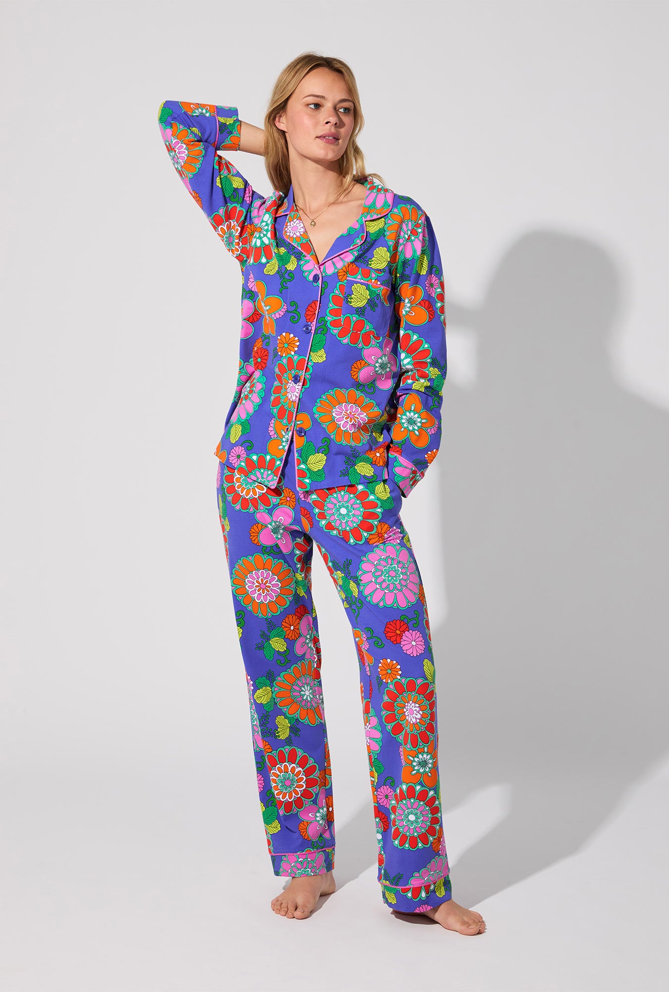 A lady wearing BedHead X Trina Turk Tokyo Floral Long Sleeve Classic Stretch Jersey PJ Set