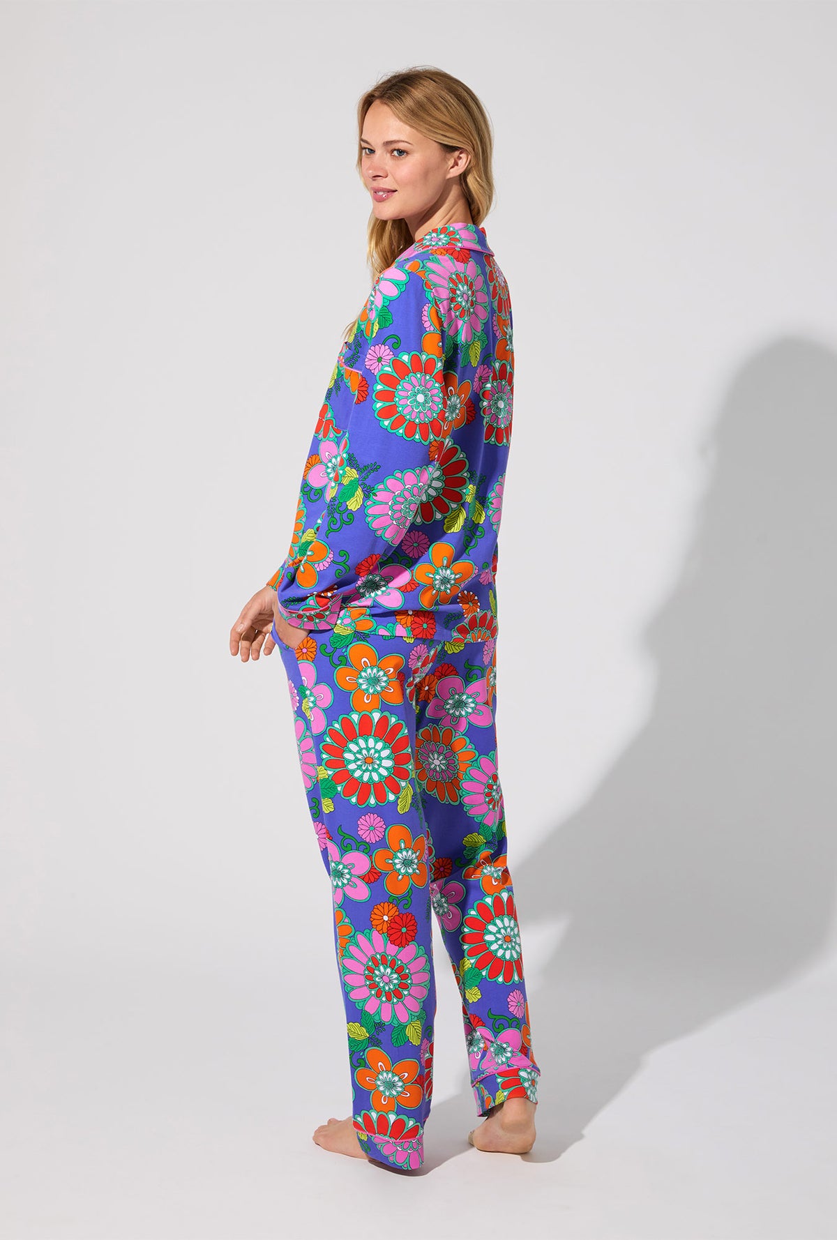A lady wearing BedHead X Trina Turk Tokyo Floral Long Sleeve Classic Stretch Jersey PJ Set