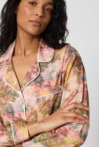 A lady wearing Autumnal Arboretum Long Sleeve Classic Woven Tana Lawn® Pj Set Made With Liberty Fabrics closer look