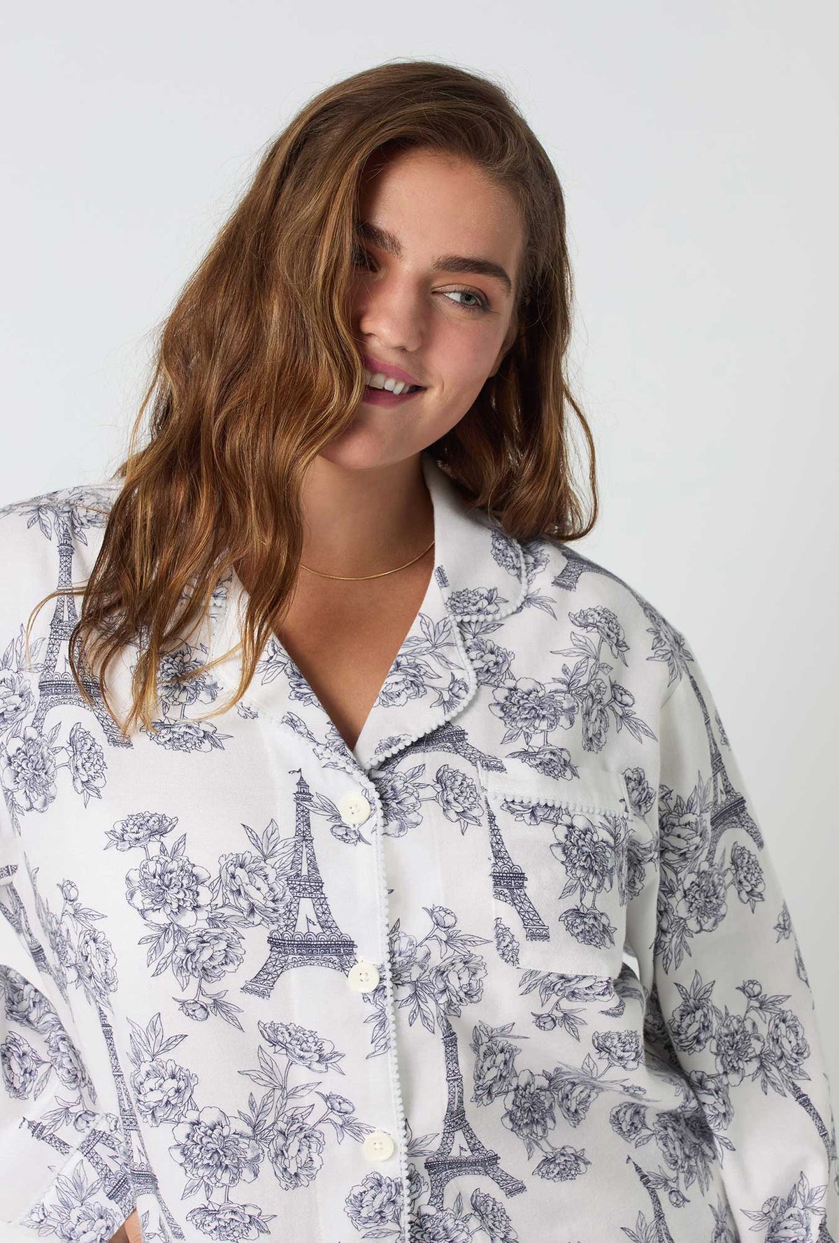 A lady wearing La Belle Eiffel Long Sleeve Classic Shorty Woven Portuguese Flannel PJ Set